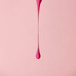 © Stocksy - Pink shade nail polish in mid-fall