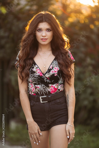 Portrait Of A Beautiful Brunette Girl With Wavy Thick Hair