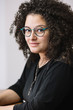 © Stocksy - portrait of a young mixed woman.