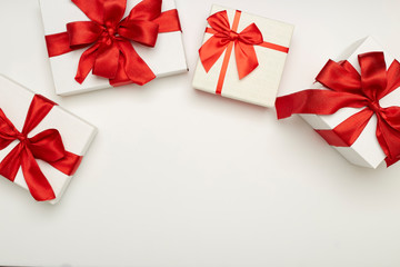 festive gift boxes with red bows