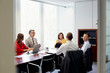 © Stocksy - Business Colleagues Discussing At Conference Table