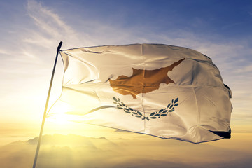 Wall Mural - Cyprus Cypriot flag textile cloth fabric waving on the top sunrise mist fog