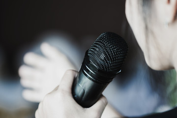 Seminar Conference Concept: Smart businesswoman speech and speaking with microphone talking in conference room. Event light convention hall Background