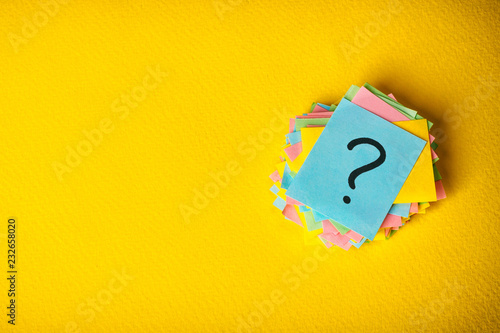 Fotomural question marks written reminders tickets on yellow vintage paper background