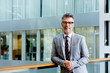 © Stocksy - Portrait Of Mature Businessman Standing In Office
