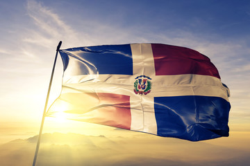 Sticker - Dominican Republic flag textile cloth fabric waving on the top sunrise mist fog