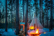 TIPI. Winter. Tipi Stands In The Winter Forest. Bonfire In The Forest. Eco-friendly Tourism. National Dwellings. National Indian Dwellings.