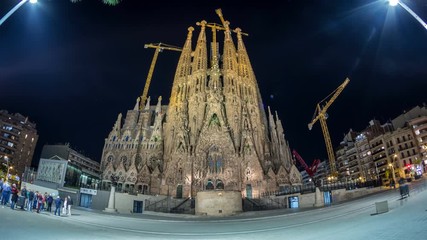 Wall Mural - Sagrada Familia, a large church in Barcelona, Spain night timelapse.