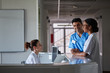 © Stocksy - Doctors and hospital assistants working at the desk
