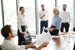 © pressmaster - Two businesswomen listening to young economist while discussing working points of report before conference