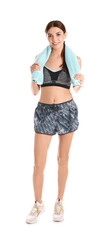 Wall Mural - Beautiful young woman in sportswear with towel on white background