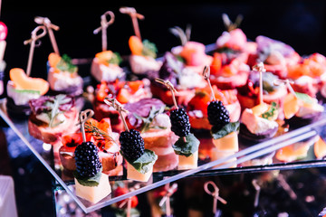 Wall Mural - Tasty decorated cheese bar with snacks for wedding Banquet. An unusual reception for the newlyweds and guests