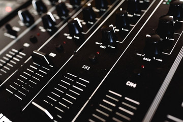 Wall Mural - Detail of the sliders of an audio mixer for DJ