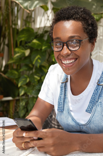 Close Up Shot Of Black Beautiful Smiling Girl Has Dark Short
