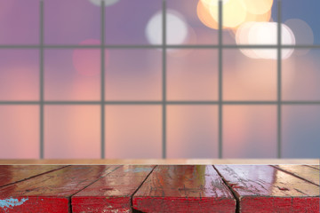Canvas Print - wooden desk with blurred light bokeh abstract background