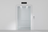 Fototapeta  - An empty modern elevator or lift with metal doors that are open.