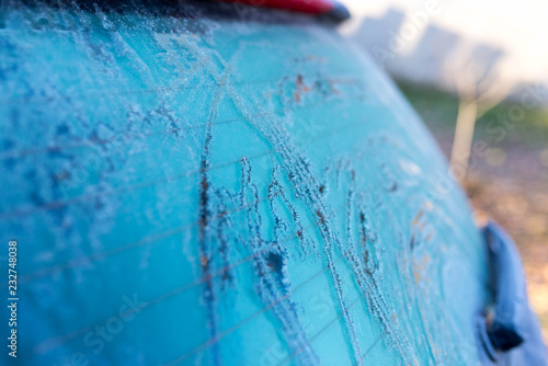 Fotografie, Obraz Frozen back window on cold morning in blue tone, image for background , space for text