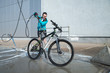 © phpetrunina14 - young sport woman washing bicycle at self-service car wash