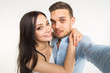© satura_ - Relationship and people concept- man taking selfie with his wonderful woman on mobile phone over white background