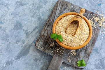 Wall Mural - Raw organic quinoa seeds in a wooden bowl.