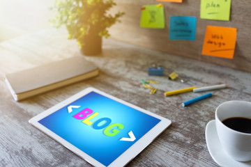 Wall Mural - tablet with blog text the on screen. social network, communication and internet marketing concept.