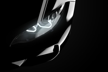 Close up on headlight of a generic and brandless modern black car