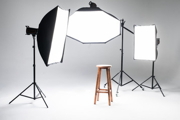 Empty photo studio with lighting equipment. Photo staff.