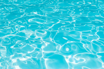 Blue and bright ripple water and surface in swimming pool, Beautiful motion gentle wave in pool