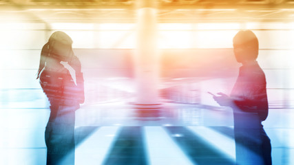 Wall Mural - Abstract businessmen in spacious office interior on city background. Double exposure