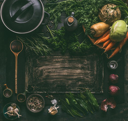 Sticker - Dark rustic food background frame with vegetarian ingredients: root vegetables, spices, cast iron cooking pot, wooden spoon and seasoning, top view. Clean food. Paleo diet. Healthy eating concept