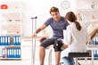 © Elnur - Handsome american footbal player visiting female doctor traumato