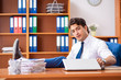 © Elnur - Young employee working in the office