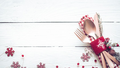 Wall Mural - Christmas dinner cutlery on a white wooden background