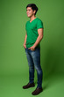 © Ranta Images - Young handsome Filipino man against green background