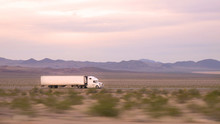 CLOSE UP: Freight Semi Truck Driving And Transporting Goods On Busy Highway