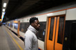 © Rawpixel.com - Man waiting for the train doors to open