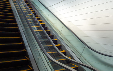 Escalator and white wall