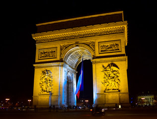 The arc de Triomphe at night in the Place de Etoille, Paris