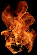 Leinwandbild Motiv magical fire ignition - burning red-orange hot flame - fiery elements isolated on a black background