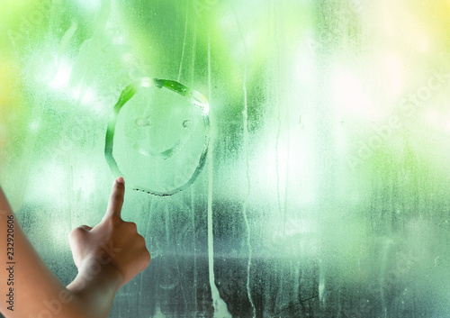 Photographie  Writing a smiley face in the middle green clear glass have dew, Concept Happy in every situation