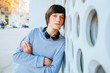 © Iryna - Outdoor portrait of handsome teen sweden boy by over white urban wall background.
