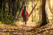 © Dusan Kostic - Beautiful girl walking trough forest in autumn season