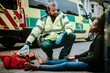 © Rawpixel.com - Male paramedic checking on an injured woman on a road