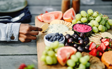 Closeup of a vegan cheese and fruit platter