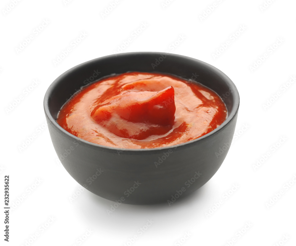 Tasty tomato sauce in bowl on white background