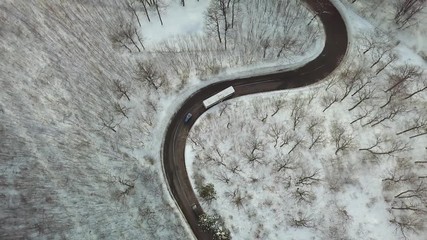 Wall Mural - Snowy mountain road by bus