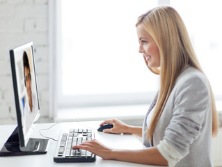 Poster - business, technology and communication concept - smiling businesswoman with pc computer having video call with partner or customer service operator at office