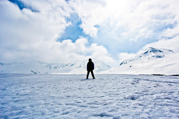 silhouette man standing on snow hill