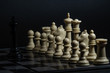 © Igor - Plastic chess closeup on a black background. A game