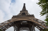 Fototapeta Paryż - View of Eiffel Tower in a day of a cloudy sky in Paris, France